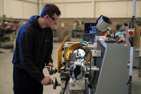Picture of Level 3 Mechanical Engineering Student, Harry, Operating XYZ Centre Lathe Machine.