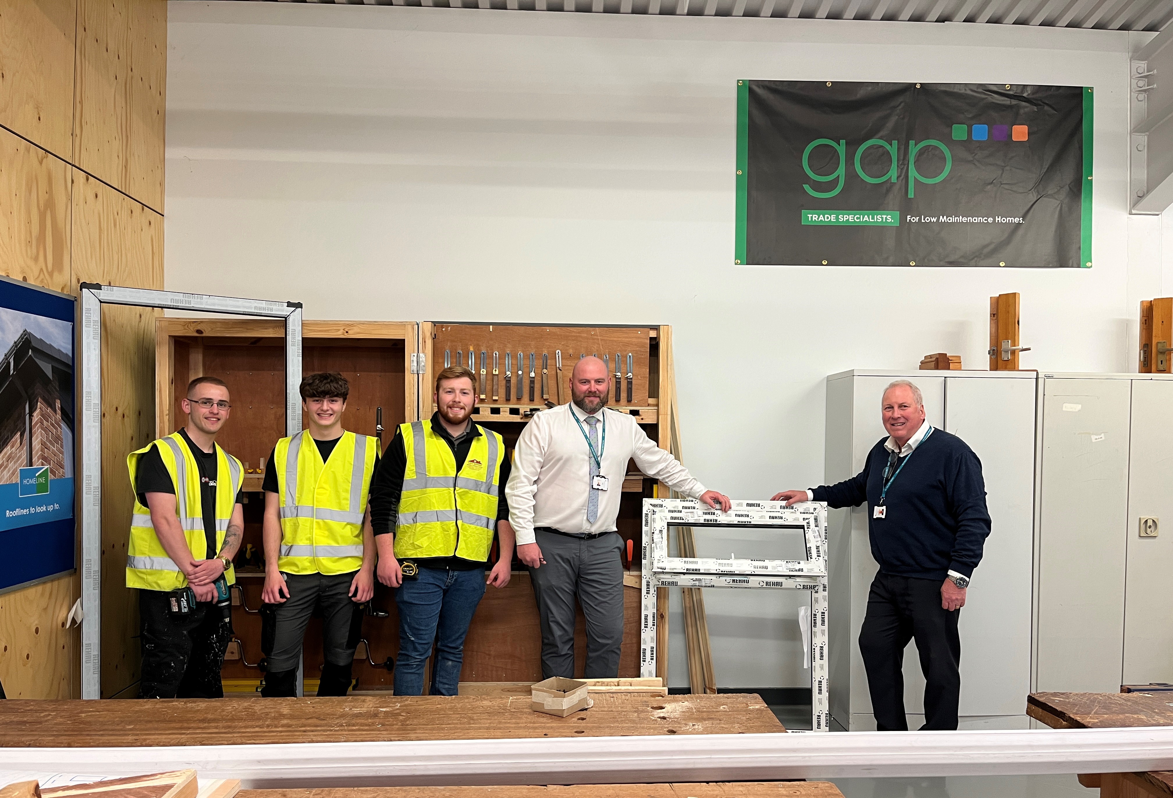Picture of carpentry and joinery apprentices and tutors with GAP donation
