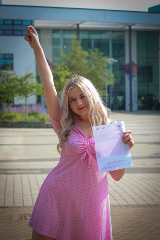 Picture of our student, Summer, with her results