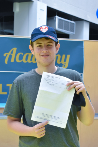 Picture of our student, Ben, with his results