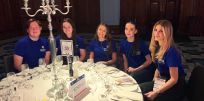 A group of our Travel and Tourism students sat at a table during their work experience with ConnectIn Events.