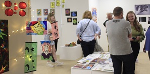 Picture of guests and artwork at the Rise Exhibition