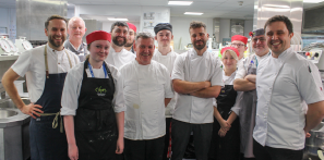Guest chefs Adam Reid, Chris Rawlinson, James Holden, Matt Hagan and Ellis Barrie, stood in the Colours Restaurant kitchen alongside staff and catering students.