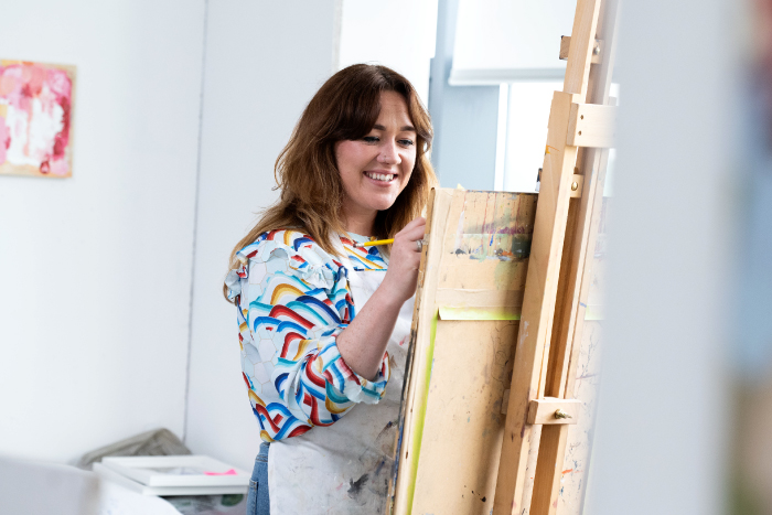 Picture of our student Karla painting