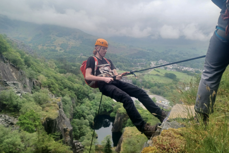 Picture of one of our students abseiling