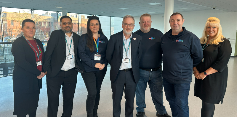 Picture of our staff with Vibe staff