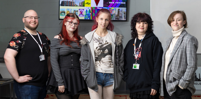 Picture of all of our art students together who had their art work displayed on the hoarding