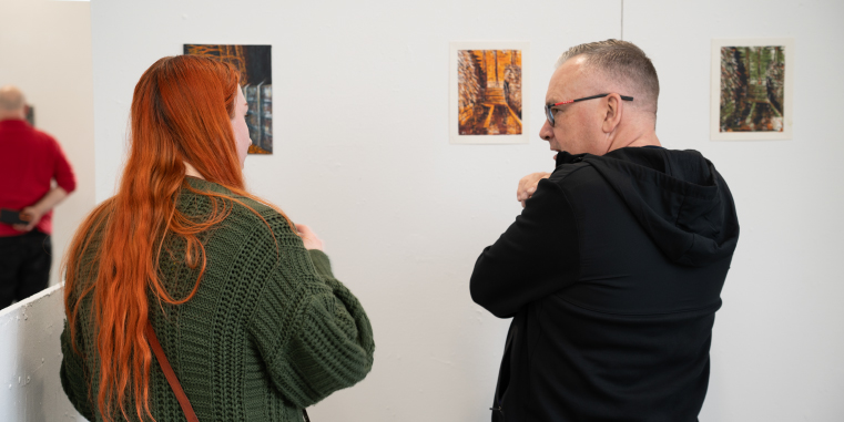 Picture of people viewing our art exhibition