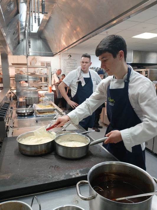 Picture of our students working in the kitchen