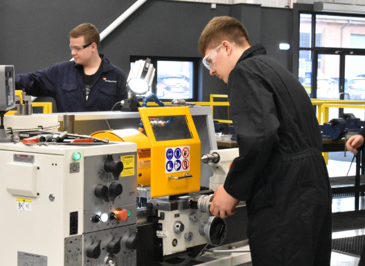 Picture of one of our students using the mechanical engineering equipment